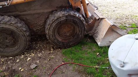 fix skid steer tires|flat tire on skid steer loader.